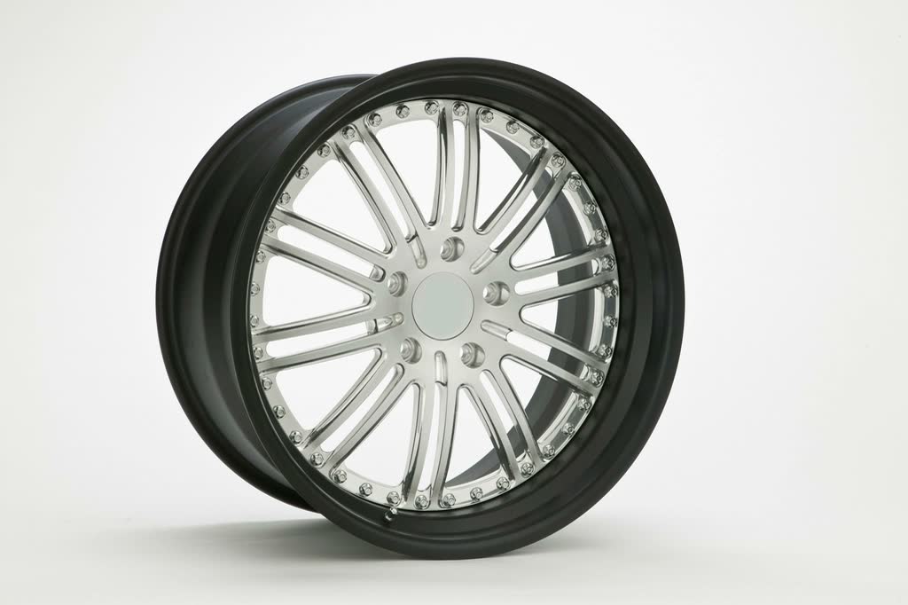 A polished multi-spoke alloy wheel with a black rim